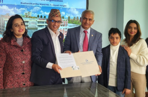 Mr. Sundar Prasad Dahal presenting a donation cheque to KIOCH representatives for the Kathmandu Children's Hospital.